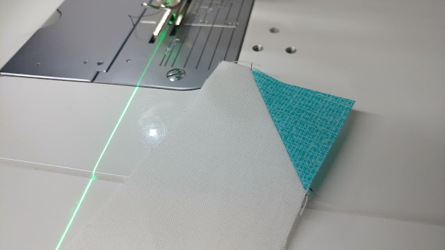Sewing stitch-n-flip corners with a sewing machine laser