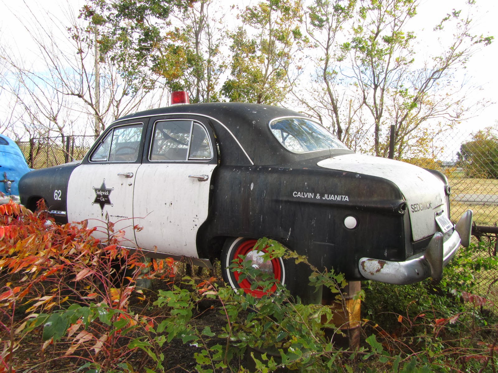 autoliterate Sedgwick County Sheriff's 1949 Ford. Salvage Yard, Wichita KS