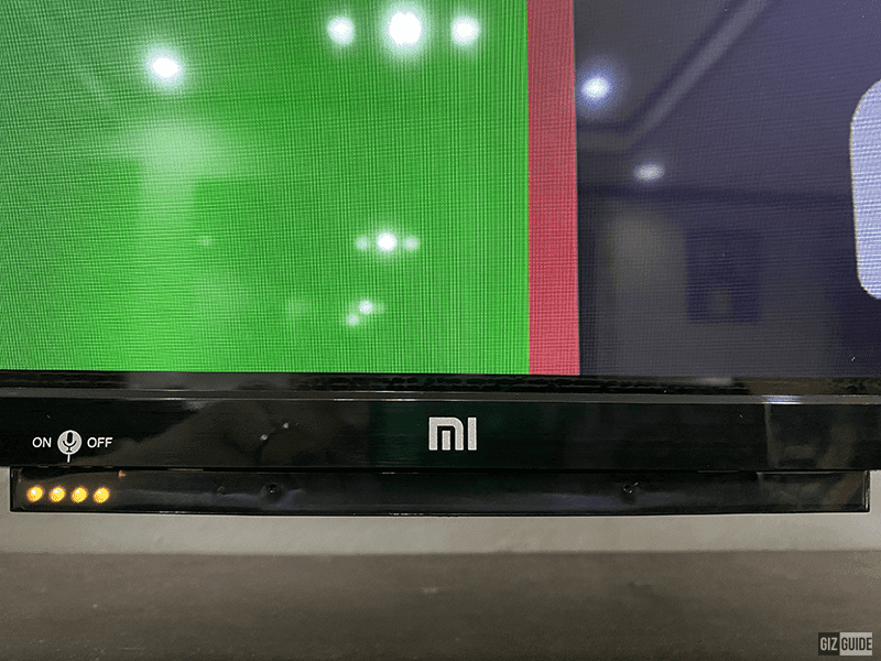 Mi branding with voice assistant LED lights indicator beside it Mi branding with voice assistant LED lights indicator beside it