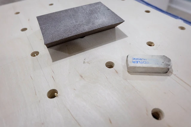 erasing pencil lines on plywood pegboard