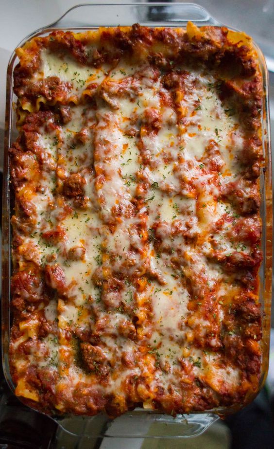 This is hands down the Best Lasagna Recipe ever! Easy, cheesy, meaty and so so delicious! Cuts perfect slices every time. Enjoy!