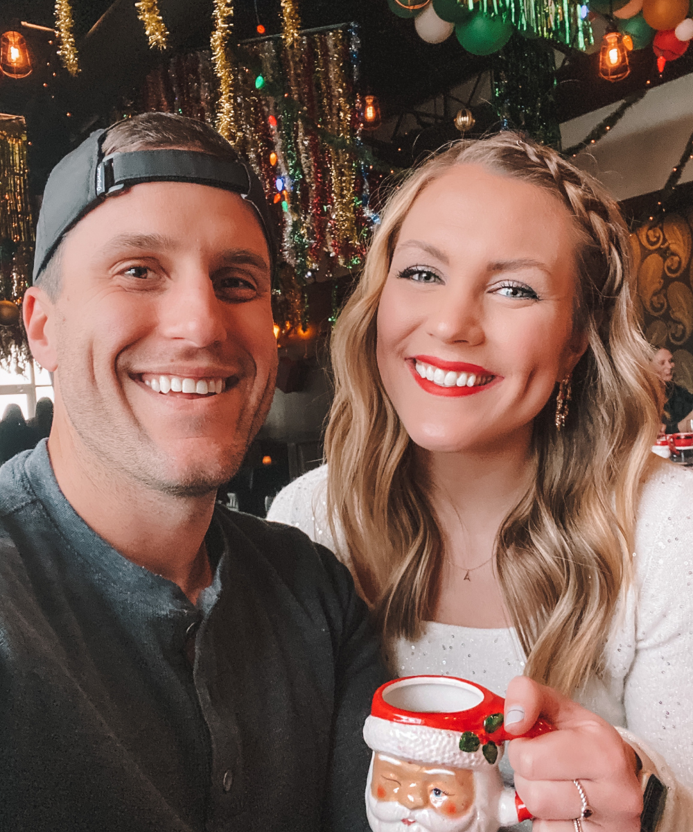 blogger @amandasok sips holiday cocktails with her husband during a Christmas date in Oklahoma City