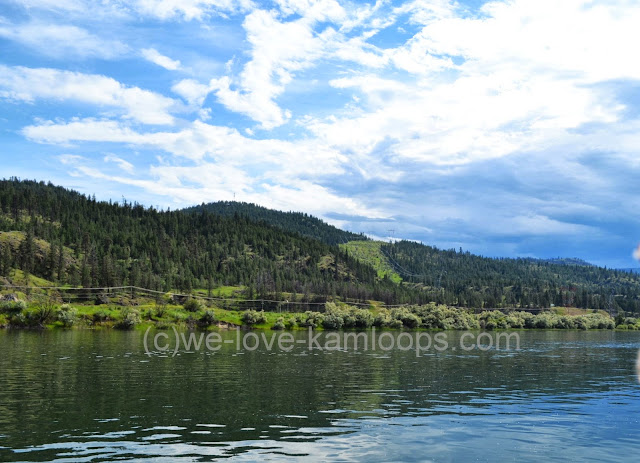 The high river water is calm for our boat ride