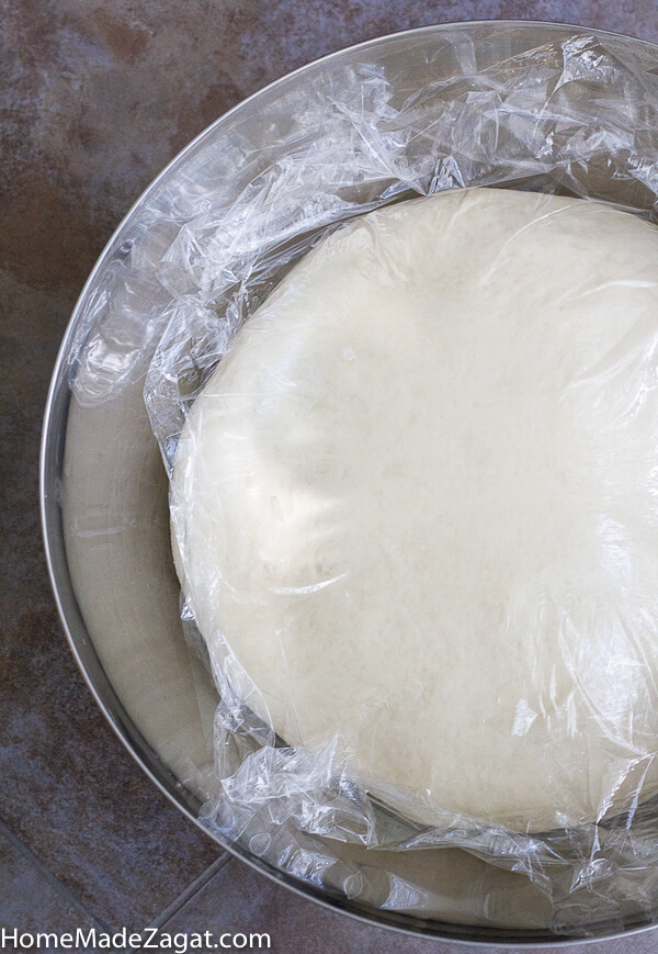 Caribbean butter bread proofing in a bowl