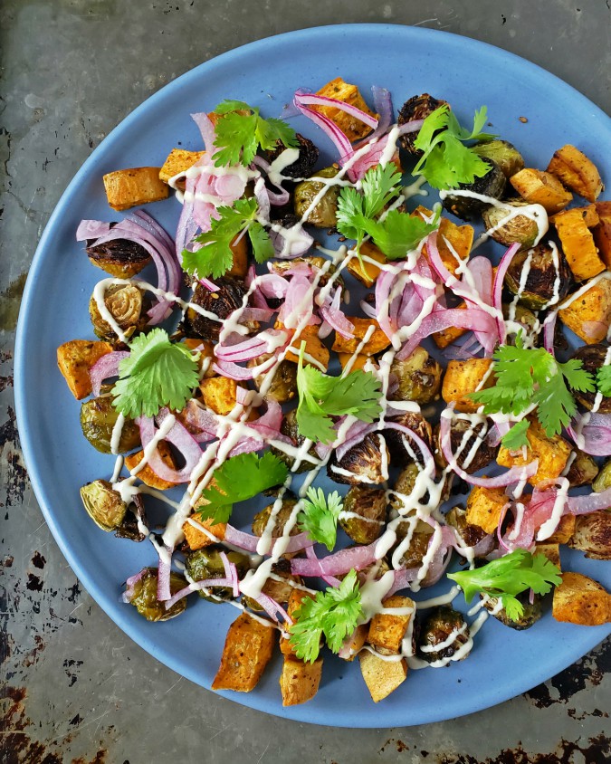 Mango & Tomato Roasted Sweet Potatoes & Brussels Sprouts With Tahini