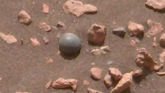 Silver metallic UFO Orb on Mars.