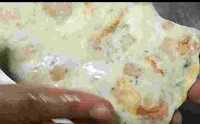 Water greased flatten dough for amritsari kulcha