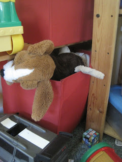 Toys overflowing from storage boxes