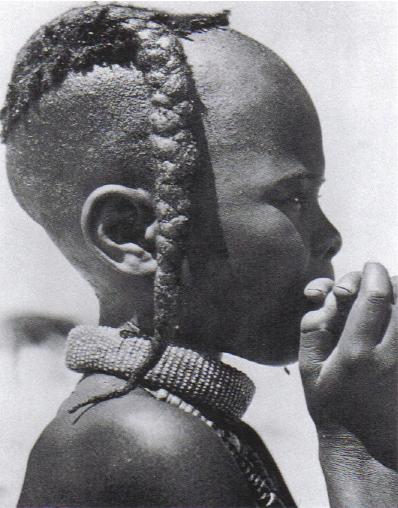  Boy with plait ozondato and ondengura neckband, Himba, Namibia, Africa Photo dated: Anneliese Scherz, 1940s 