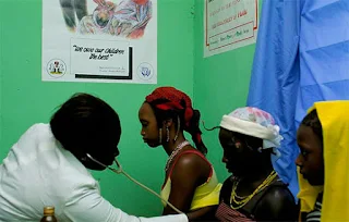 Doctor in Nigeria Africa examines patients.