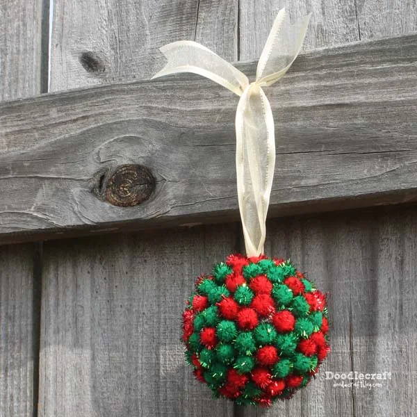 Pom pom ornament with a secret compartment inside! Perfect for Christmas gifts or commitments