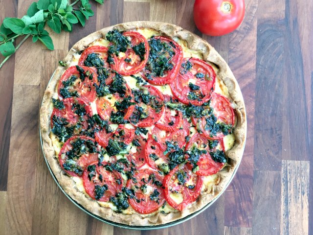 Summer Tomato Tart: A cheesy tomato tart with fresh herbs on buttery pastry. A thin layer of Dijon mustard spread under the tomatoes gives it a little bite.