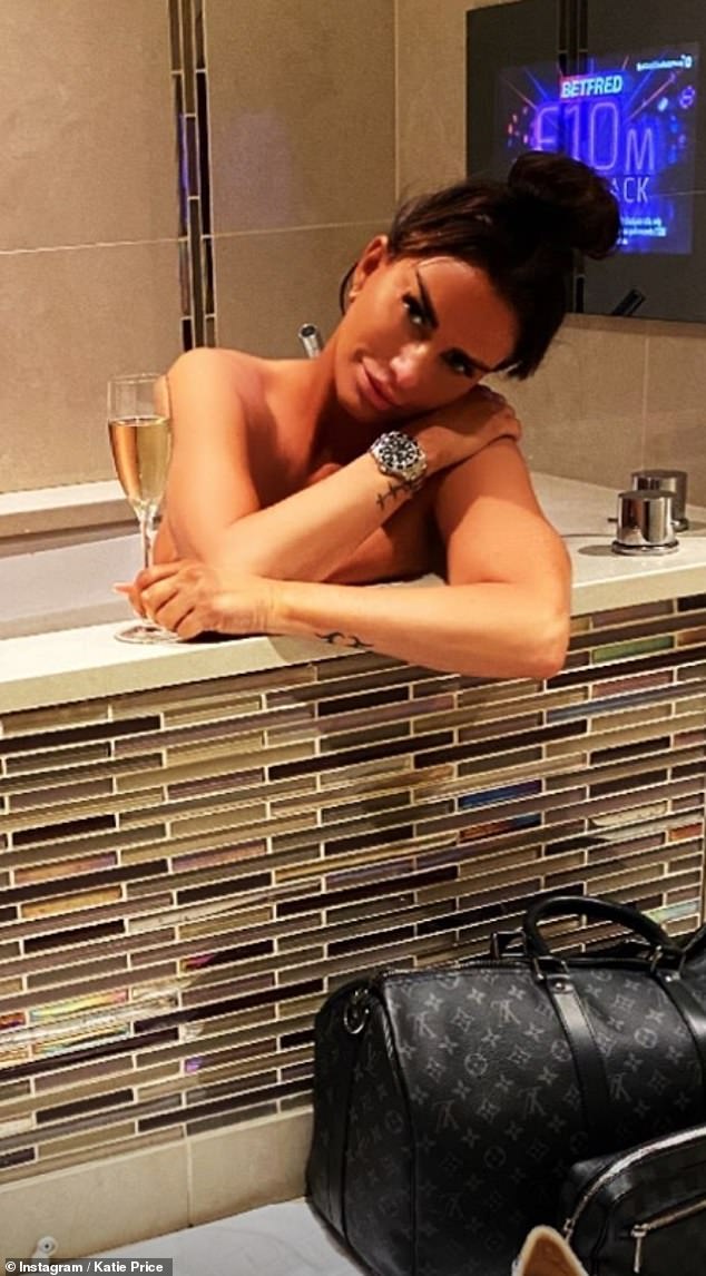 Katie Price poses naked in the bathroom on Saturday while looking back on a 'difficult year'