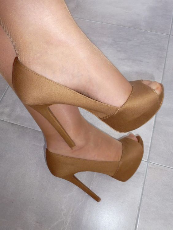 Nude tights and brown pumps