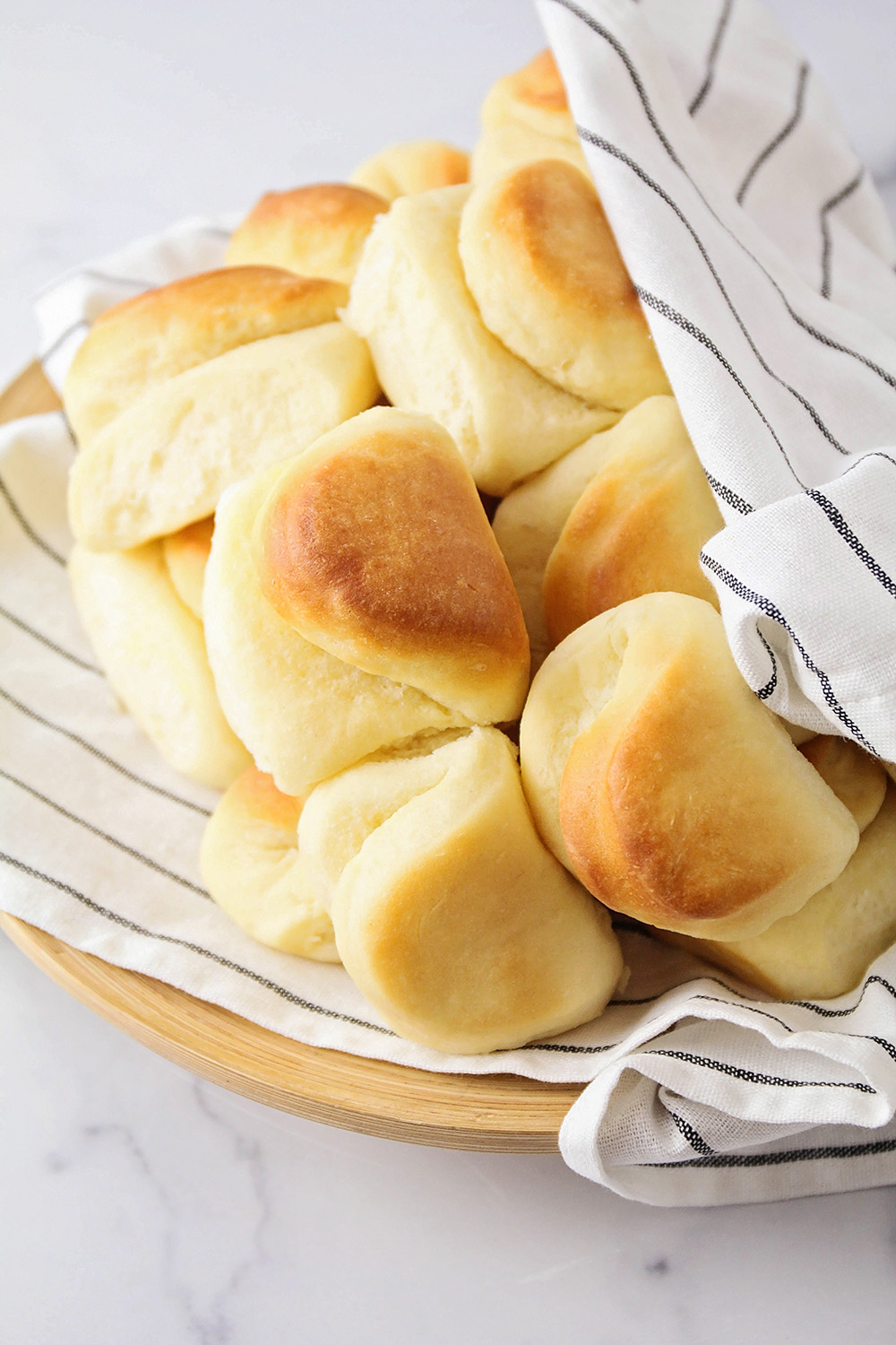 These Parker house rolls are so tender and soft, with the perfect light texture and buttery flavor!