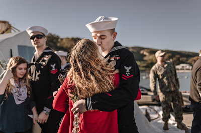 Military Sailor meeting baby for the first time at Naval Base Point Loma, California . Images by Morning Owl Fine Art Photography. 
