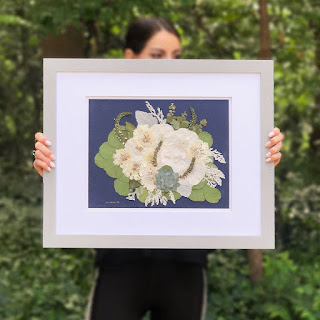 Framed Bouquet Idea Wedding Ideas - framed flowers with female hands holding it - dbandrea - Wedding Ideas - framed wedding flowers - dbandrea - Wedding Soiree Blog by K'Mich - wedding planners in Philadelphia PA