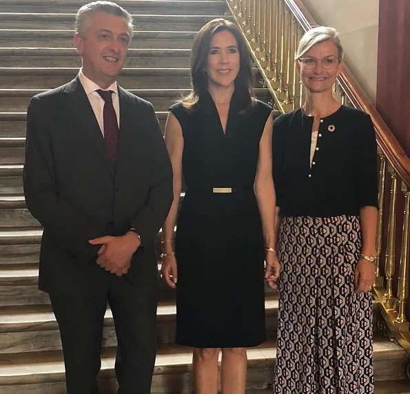 Crown Princess Mary attended a meeting with UN Refugee Chief Filippo Grandi at Amalienborg Frederik VIII's Palace. she wore black dress by Prada