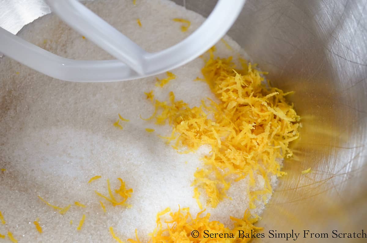 Sugar and Lemon Zest in a stainless steel mixing bowl for Chewy Lemon Cookie Batter.