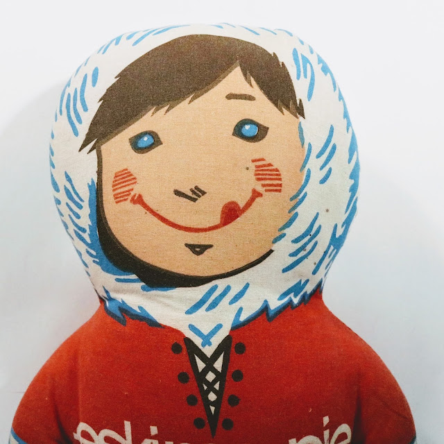 picture of doll wearing winter coat