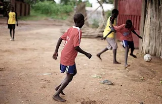 Playing soccer in Ghana.