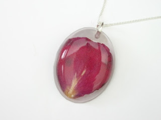 Resin pendant containing a preserved Rose petal