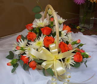 mother's day flower basket with a beige ribbons