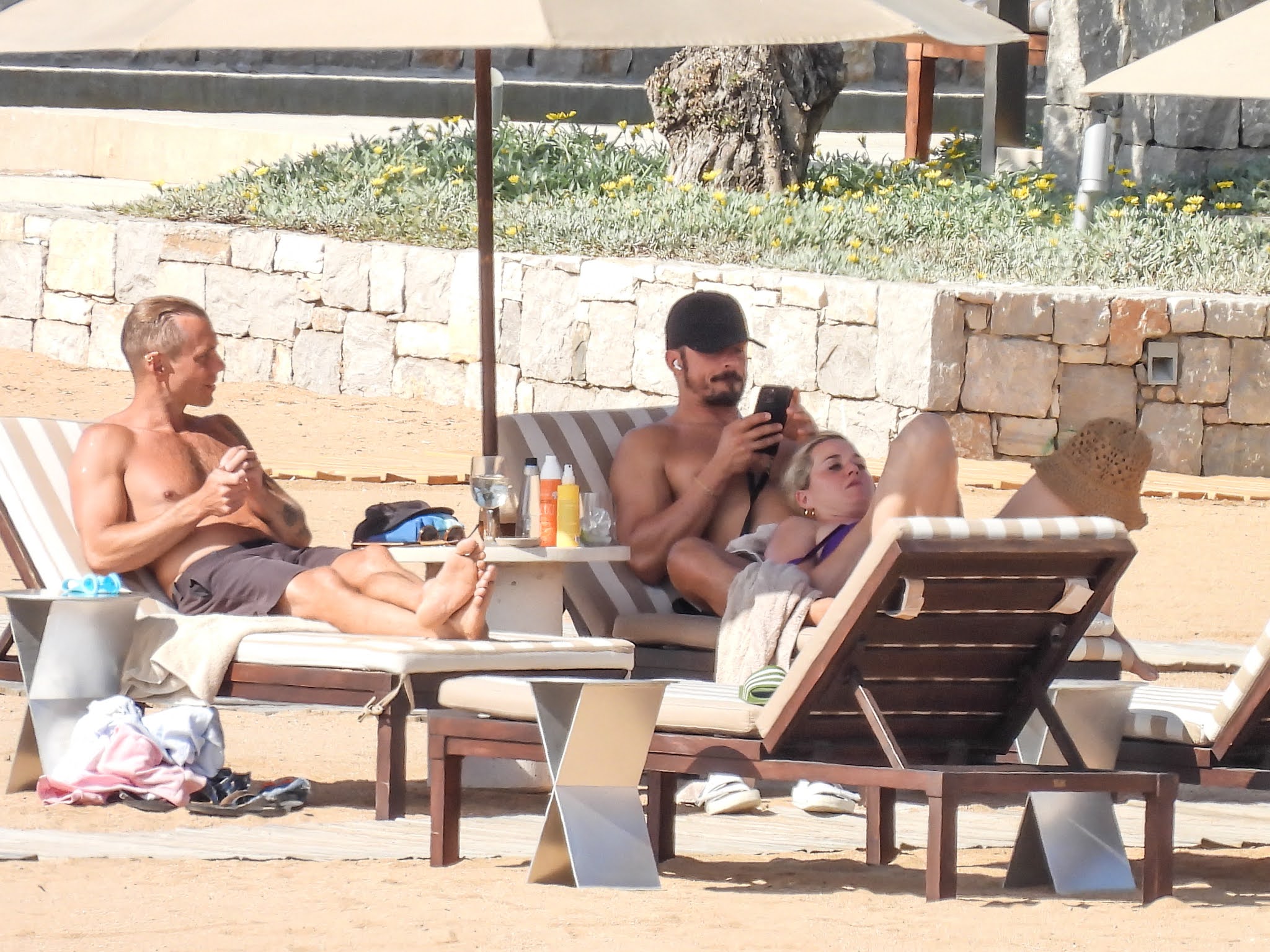 Katy Perry in a purple swimsuit with beau Orlando Bloom at a Beach in Greece