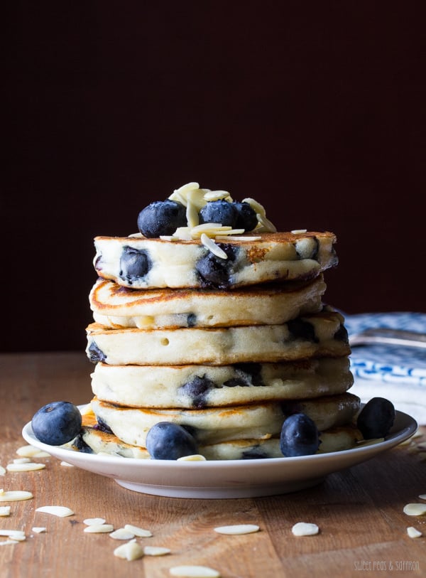Extra Fluffy Almond Blueberry Pancakes - These pancakes are extra thick & fluffy with the addition of Greek yogurt, and are full of fresh blueberries, slivered almonds, and lemon zest.