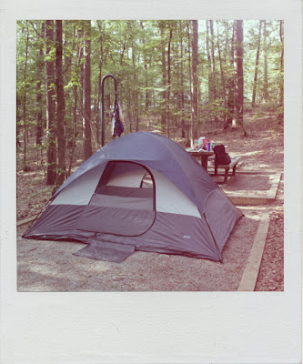 a dome tent in the woods polaroid 
