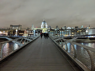 A view of St Pauls at night from the Millenium Bridge