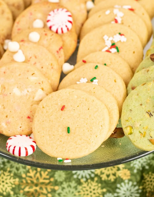 cookies on a green plate with a peppermint candy garnish.