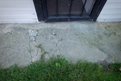 back door backyard concrete walk broken cracked