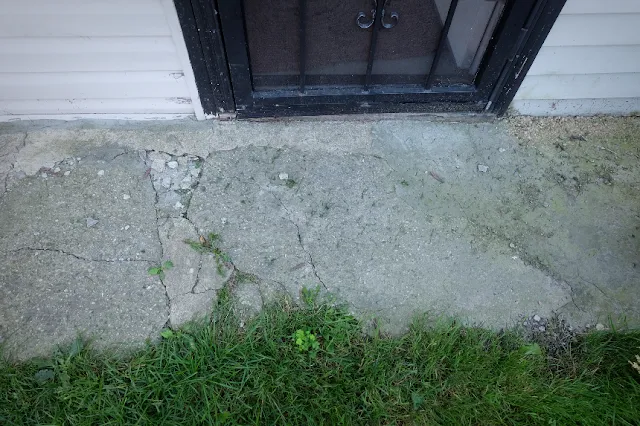 broken concrete walk by back door