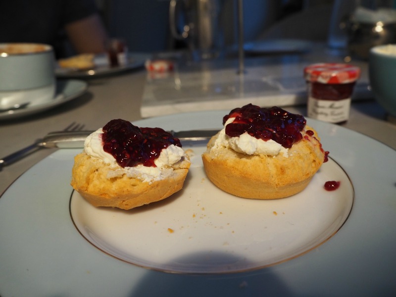 Scones topped with cream and jam