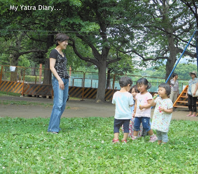 Children enjoy themselves at Hibiya Garden - Tokyo, Japan