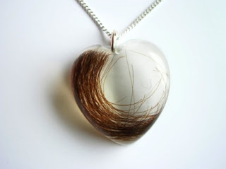 Heart shaped pendant for a preserved lock of hair