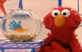 Dorothy is not alone her bowl, she has a blue hand in her bowl. Elmo's World Hands Dorothy's Question