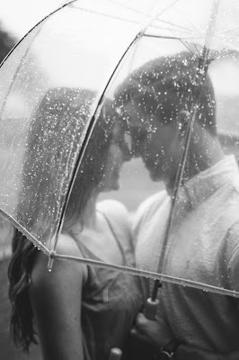 couple holding each other tightly in rain