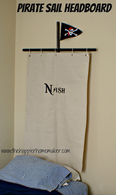 A pirate sail headboard with the name "Nash" on it