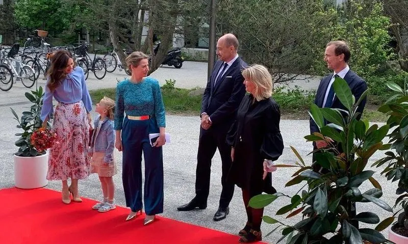 Crown Princess Mary wore a flare sleeve knot blouse from Victoria Beckham, and sunray pleated scarf print skirt from Paul and Joe