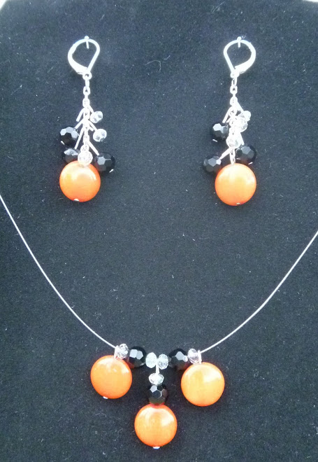 Orange stone, black Swarovski beads.