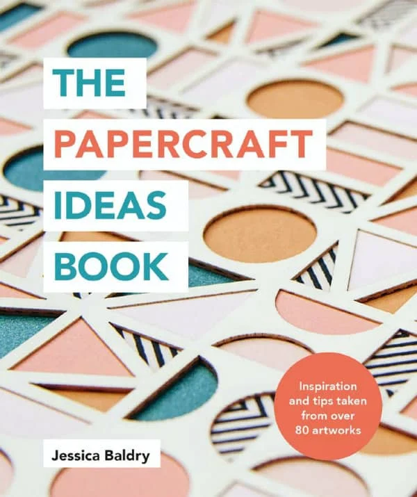 layered geometric paper art on book cover