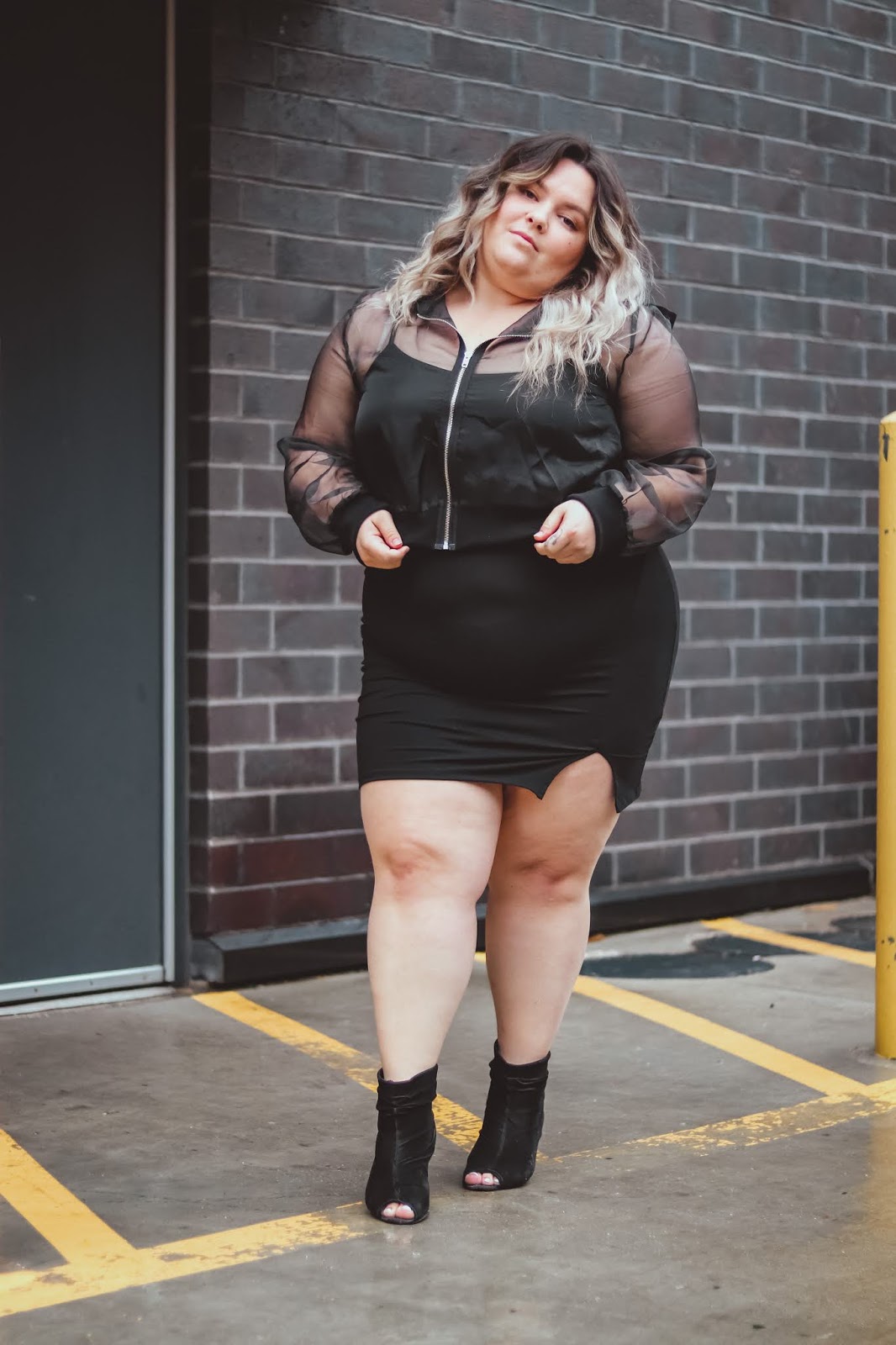 Chicago Plus Size Petite Fashion Blogger, influencer, YouTuber, and model Natalie Craig, of Natalie in the City, reviews Forever 21's cropped hoodies and bodycon mini dresses.