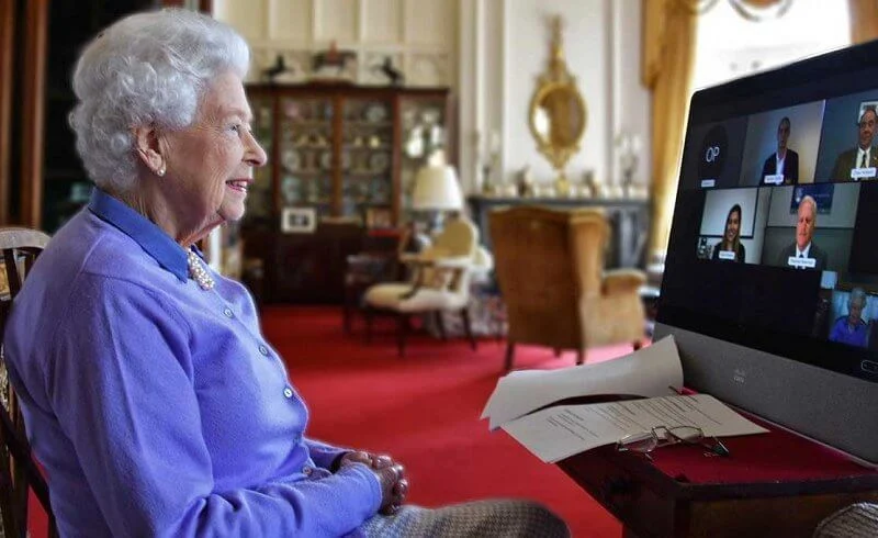 Queen Elizabeth wore a blue cashmere cardigan and a blue shirt