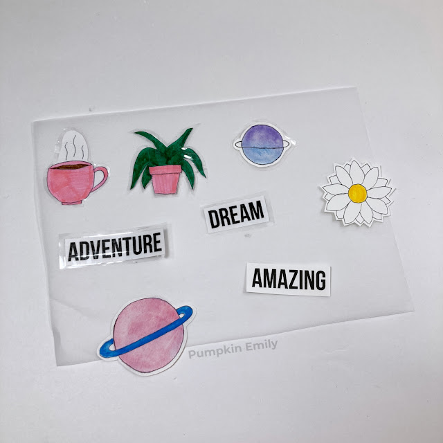 DIY stickers made with tape and sticker paper laying on parchment paper.