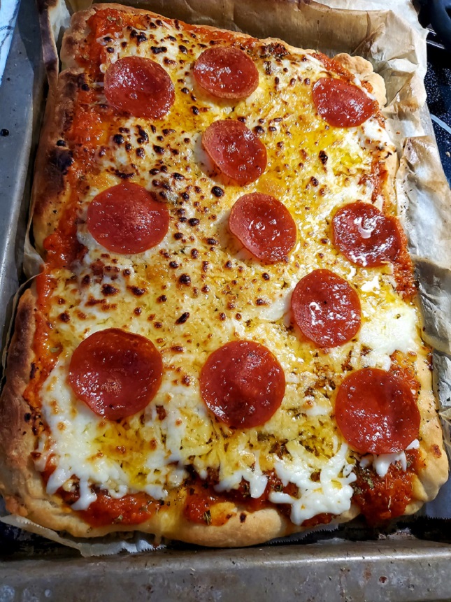 this is an inch thick Sicilian Style Pizza with cheese and pepperoni