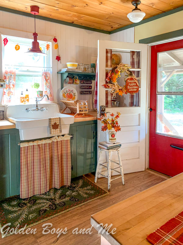 American standard country sink in kitchen in vintage mountain cabin.