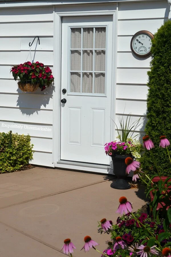 Garage Door Curtain visible from flower filled garden