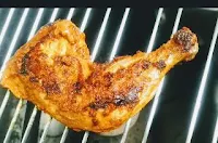 Tandoori chicken leg piece on bbq grill ( jali) for Tandoori chicken recipe on gas top